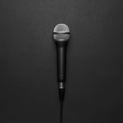 black silver microphone black background scaled